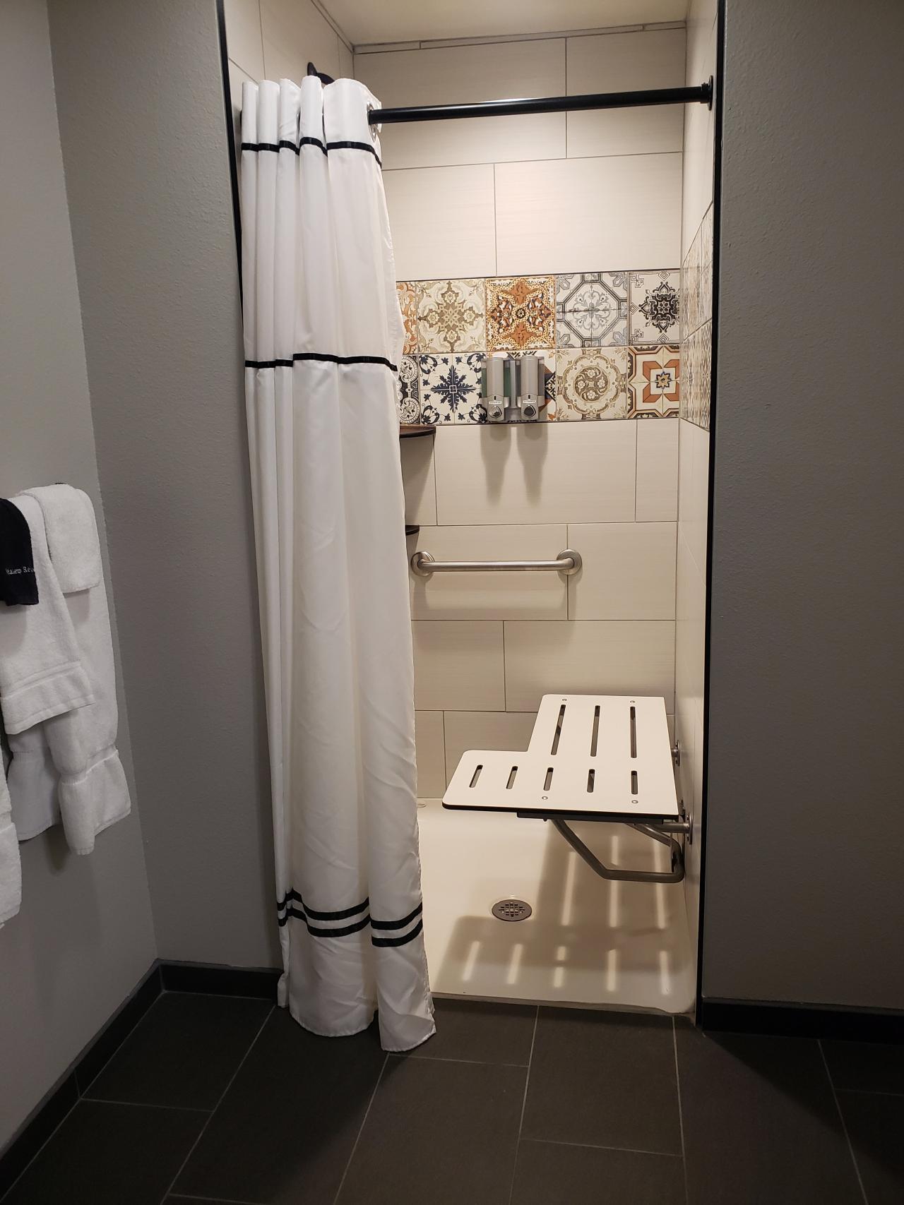 A view of the ADA transfer shower option in the bathrooms for the king rooms at the Ozark Folk Center State Park